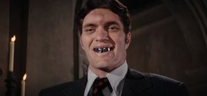 Jaws, a big burly assassin wearing a three-piece suit, bares his huge metal teeth.